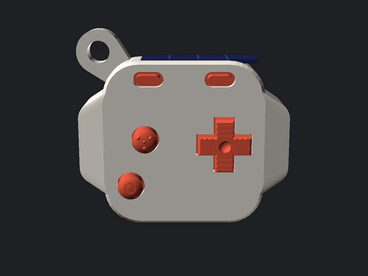 The back of the keychain prototype, flipped over, showing a textured D-pad and round A and B buttons