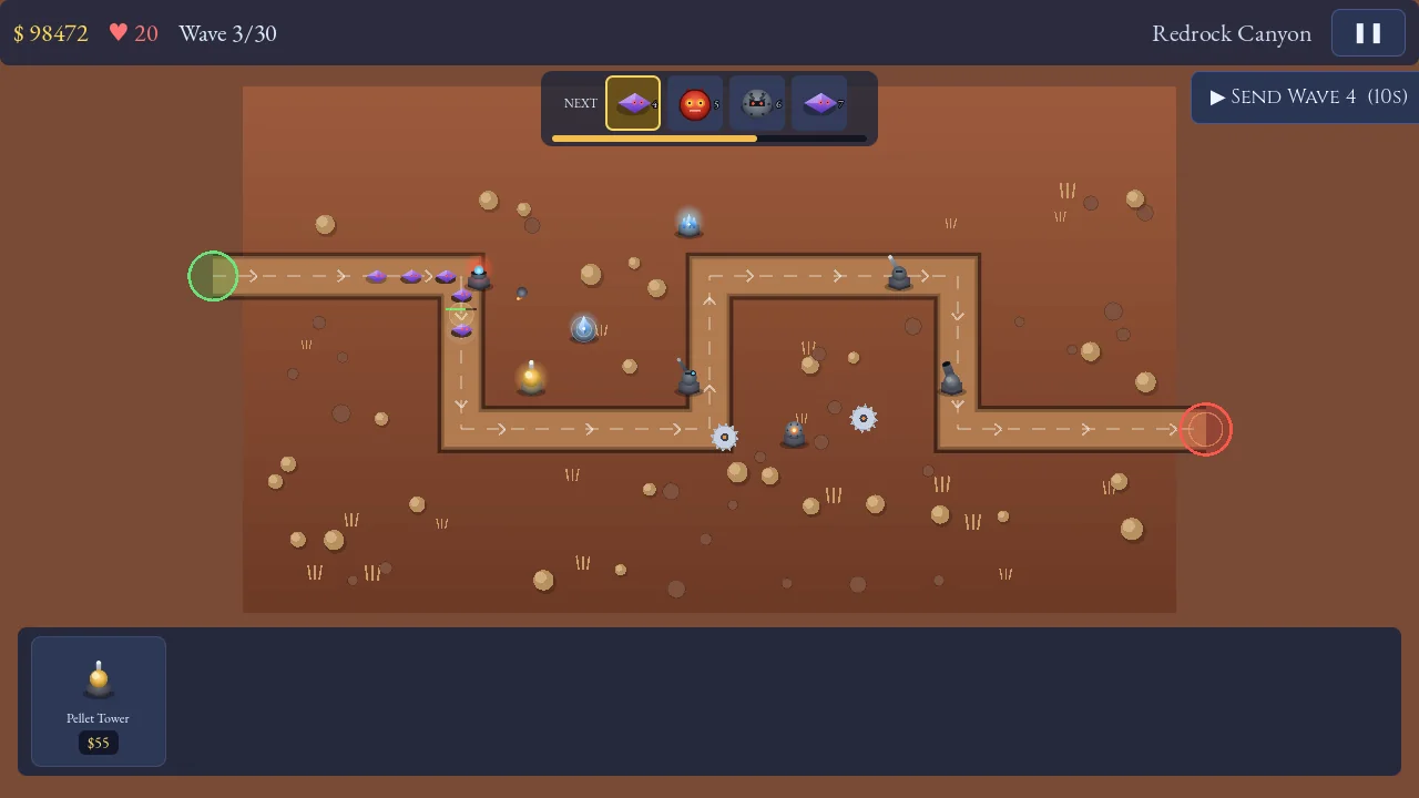 Tower Onslaught on the red Redrock Canyon map with towers defending a long winding road against a wave of enemies